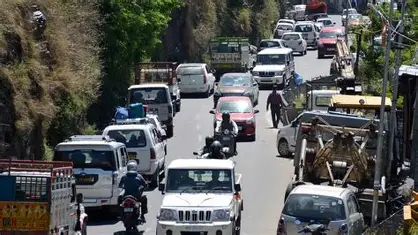 Long traffic jam on Shimla's roads due to tourist vehicle influx.