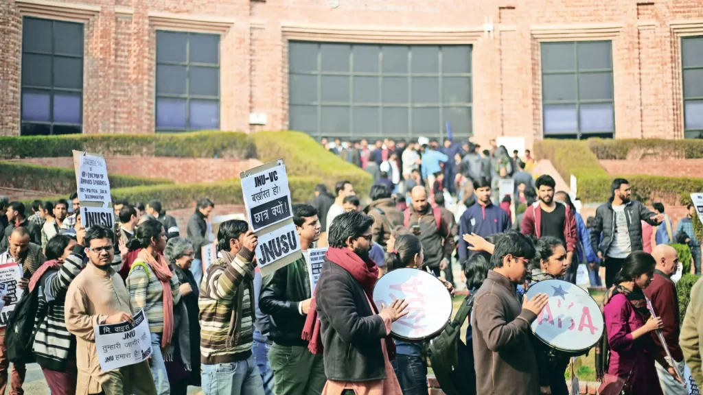 JNUSU protests UGC-NET rule for PhD admissions.