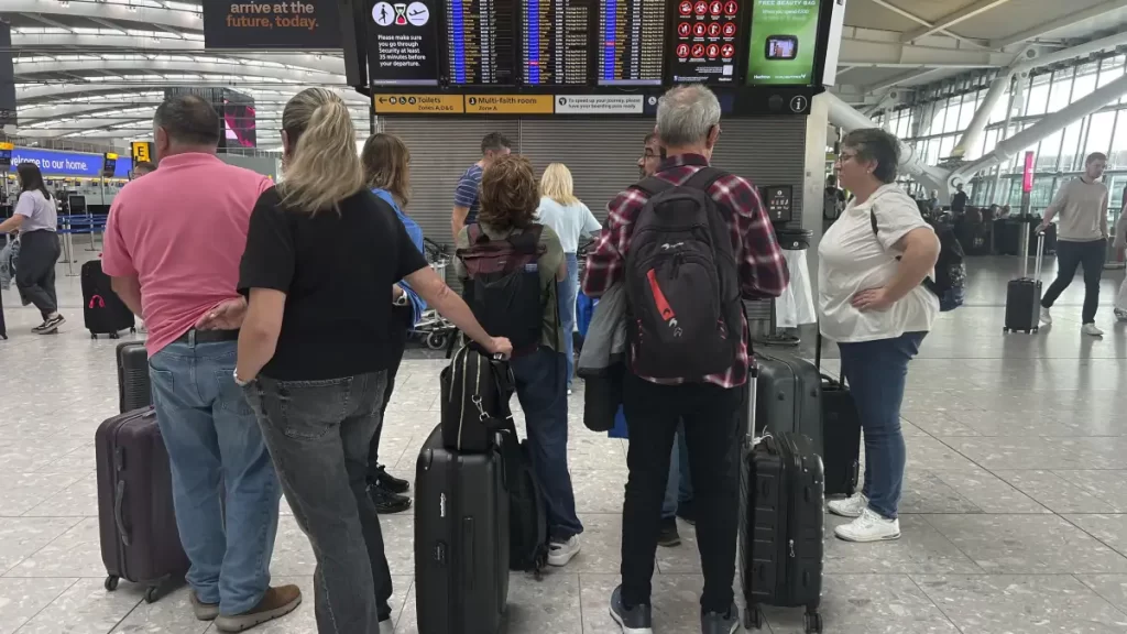 Passengers at crowded airport terminal