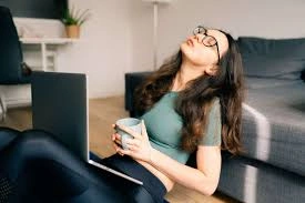 Exhausted professional on smartphone