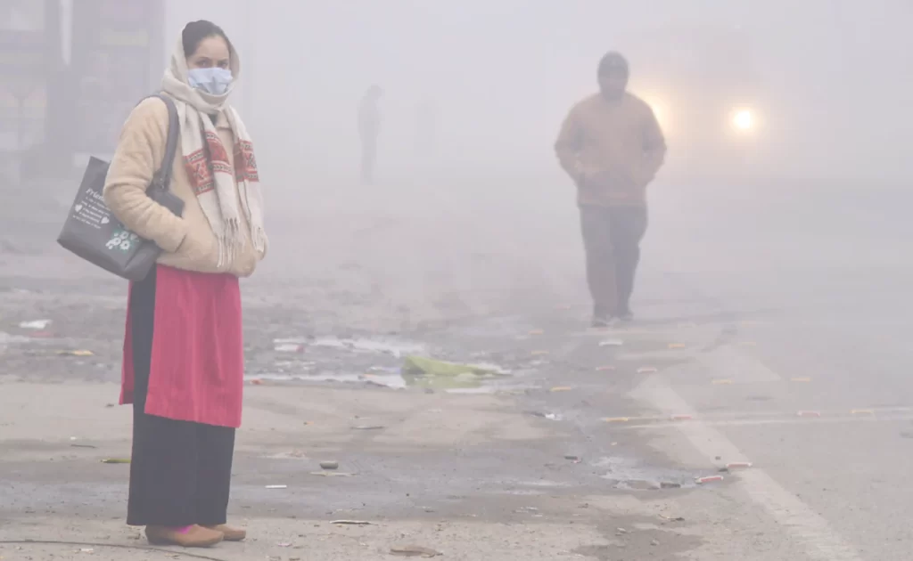 Smog-choked city skyline signals urgent pollution crisis.