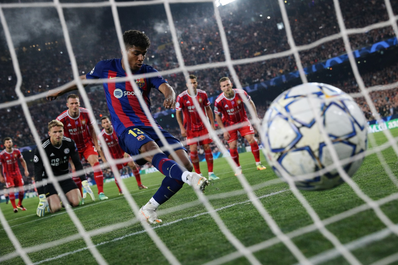 Soccer player taking a penalty kick.