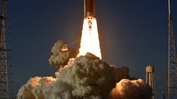 Four Artemis II astronauts pose in spacesuits