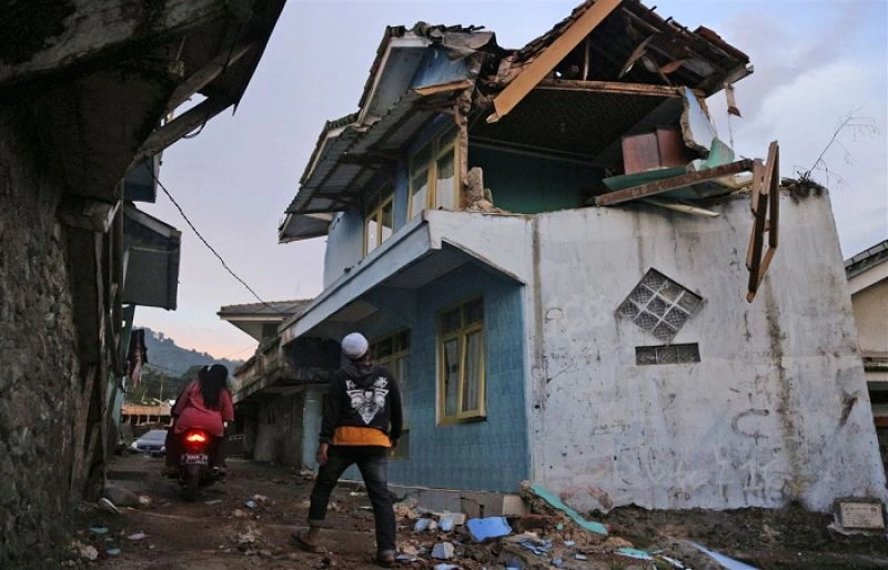 Collapsed building debris after Indonesia earthquake.